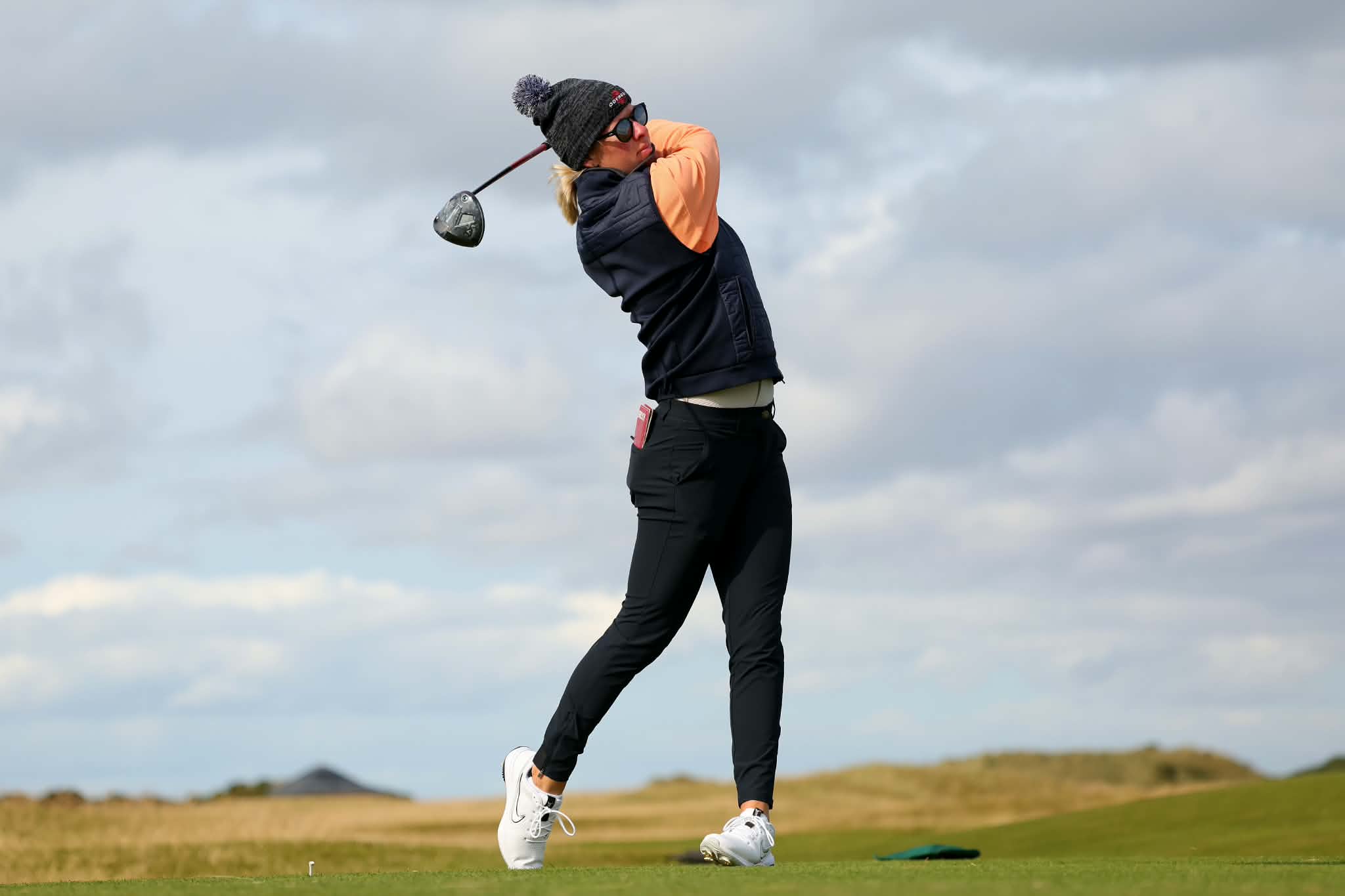 Nicole playing golf